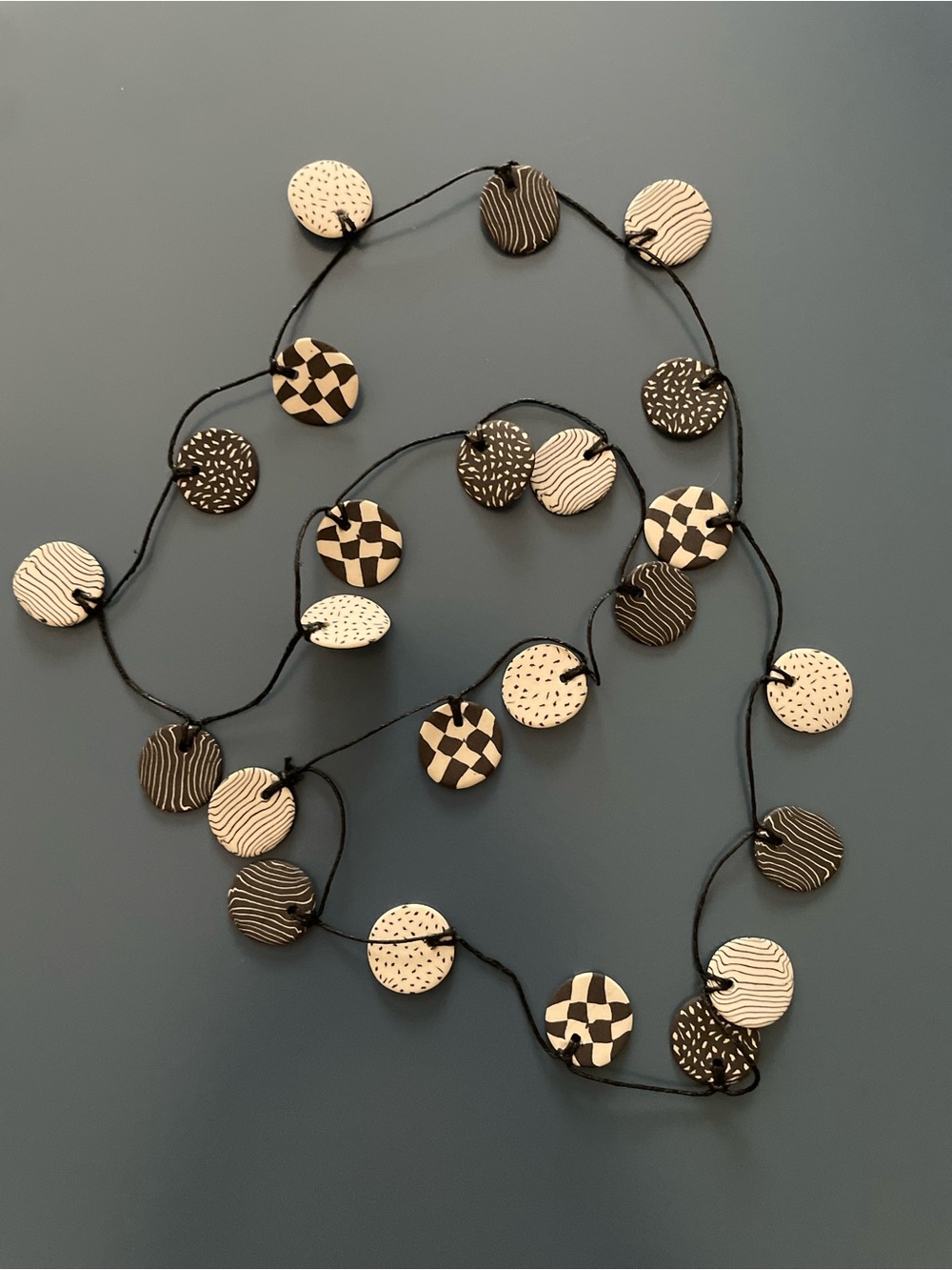 Handmade Porcelain Black and Cream Corded Disk Necklace Apx. 34 Inches
